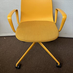 Yellow guest conference chair with armrests, ideal for meetings and events.