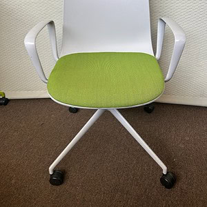 Verve white and green guest chair for stylish office or lounge seating.