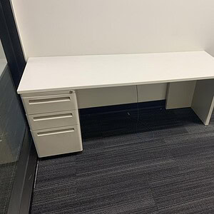 Modern Herman Miller 6 ft desk with pedestal, sleek white finish, ideal for office spaces.