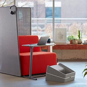 Privacy divider with integrated seating for modern office spaces.