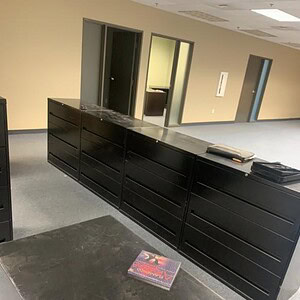 Black Korden 36-inch wide three drawer lateral file cabinet for office storage.