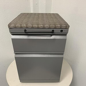 Herman Miller mobile pedestal with comfortable cushion, ideal for office storage and ergonomic seati.