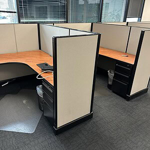 Herman Miller A02 dark tone office cubicle with BBF storage units in workspace.