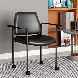 Modern black office chair with armrests on a gray and white patterned rug.