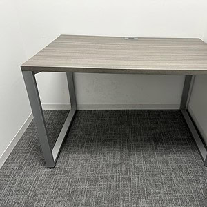 Modern Driftwood Allsteel desk, 46x30 inches, ideal for office spaces.