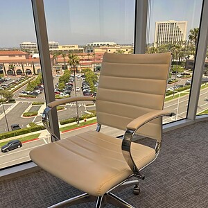Euro Eames styled white seat with chrome base for modern office decor.