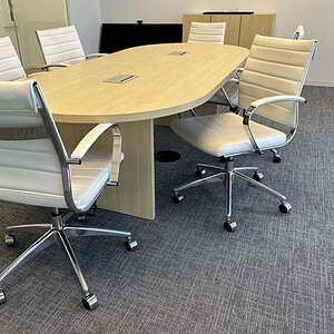 Maple conference table for professional office meetings and collaboration.