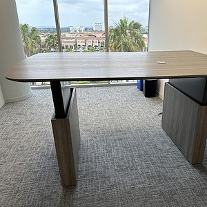 Adjustable Allsteel desk with driftwood finish, 6ft length, trapezoid shape, perfect for modern offi.