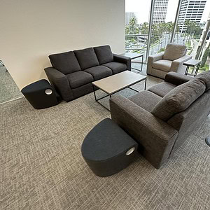 Living Spaces grey and neutral living room furniture set with sofas and armchairs.