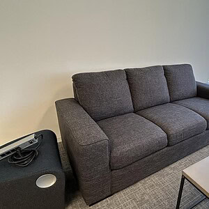Three Person Dark Grey Sofa for Living Spaces.