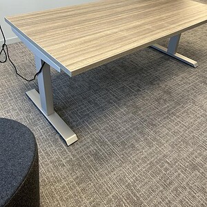 Height adjustable office desk for ergonomic workspace solutions.