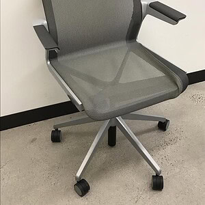 Allsteel mesh back grey office chair with silver frame, ergonomic design, adjustable armrests, and c.
