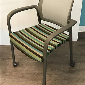 Haworth striped mesh chair with casters, ergonomic office seating for comfort and mobility.