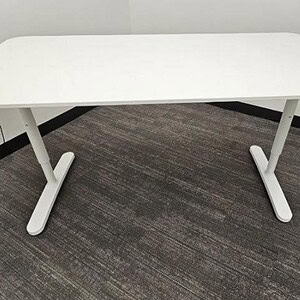 White desk with steel legs, ideal for office or home workspace.