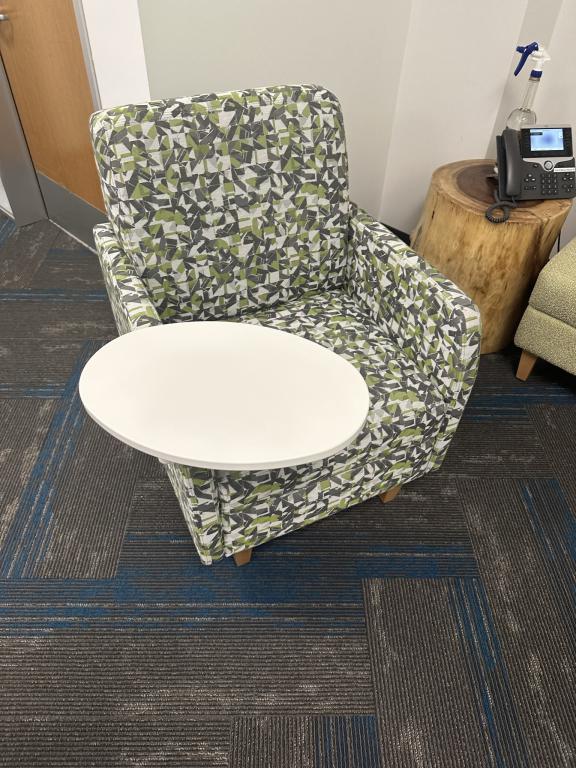 OFS green patterned lounge chair tablet arm