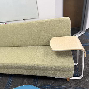 Green commercial sofa with wood legs, ideal for office or lounge spaces. Modern design and comfortab.