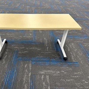 Nesting table with maple wood top and white metal base, ideal for versatile office or home use.