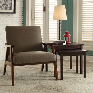 Armchair with fabric upholstery and wooden legs for living room decor.