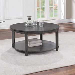 Elegant round coffee table with dark wood finish and lower shelf for storage.