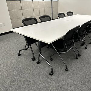 OFS 12x4 white mobile conference table with 4-piece setup, ideal for meetings and collaborative work.