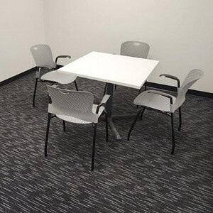 Herman Miller 3x3 ft white square table with four chairs for office meetings.