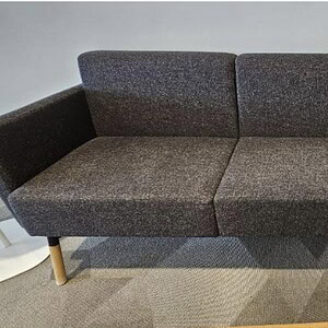 Grey Hightower sofa with slanted wood legs, 7-foot length, modern and stylish for living rooms.