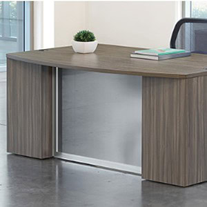 Modern double pedestal desk with glass modesty panel for office spaces.