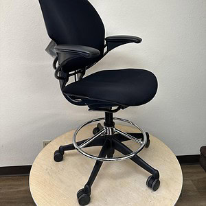Office ergonomic chair with headrest for comfort.