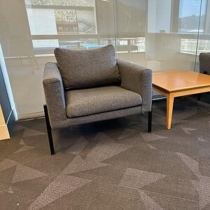 Comfortable Gunlocke guest chair in wolf grey fabric with durable steel legs. Perfect for modern off.
