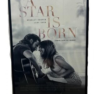 Framed "A Star is Born" poster featuring Bradley Cooper and Lady Gaga, perfect for movie fans.
