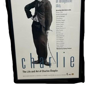 Charlie Chaplin framed poster for wall decor, showcasing his iconic look and timeless appeal.