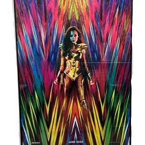 Wonder Women poster with vibrant colors and dynamic background.