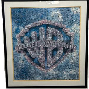 Warner Brothers mosaic pop art featuring the Warner Bros. logo in a framed artwork.