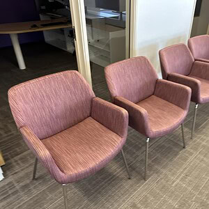 Elegant Coalesse Bindu side chairs in mixed rose fabric, ideal for modern office or lounge settings.