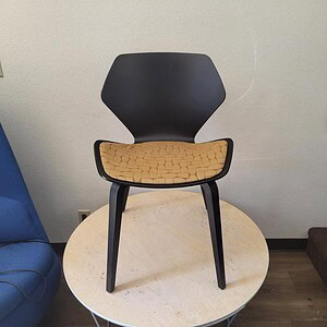 Black and yellow Ginko chair for modern interior decor.