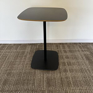 Modern black square table with rounded edges, ideal for office or home use.