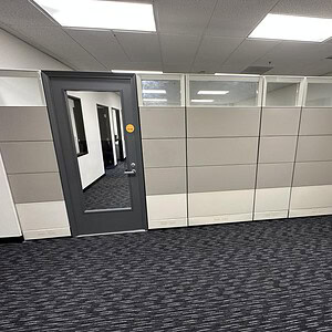 Modern office space with 86-inch Herman Miller Ethospace glass divider.
