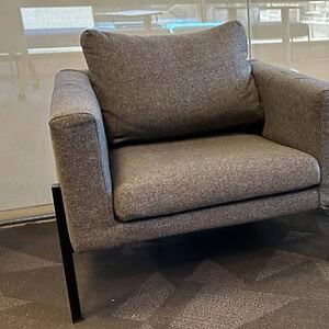 Guest chair with steel legs in wolf grey fabric for modern office spaces.