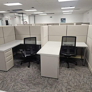 Ethospace cubicle with grey surface panels and ergonomic office chairs.