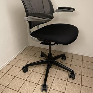 Black Humanscale Liberty ergonomic task chair for office comfort.