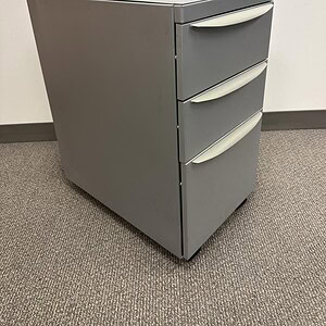 Haworth Grey mobile pedestal with three drawers, ideal for office storage and organization.
