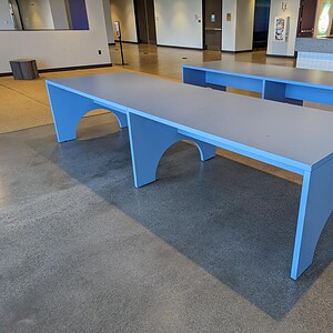 Soft Blue Arch Conference Table for modern meeting rooms.
