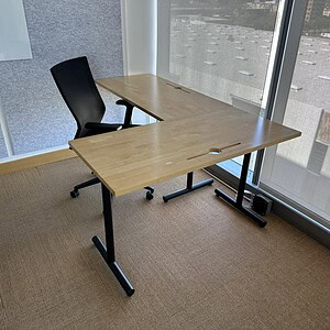 Maple office desk with black metal frame, ideal for modern workspaces and productivity.