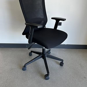 Black mesh ergonomic task chair for office comfort and support.