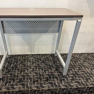Boss Bar Height Table 4-20 ft long with integrated power outlets for versatile use.