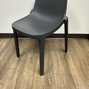 Emaco & Starck black stacking guest chair, modern design, durable plastic seat, ideal for office or.