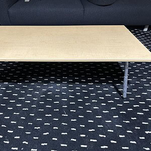 Adjustable maple coffee table with metal legs, perfect for modern living spaces.