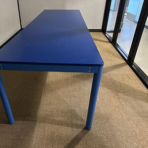 Blue 10-foot conference table for corporate meetings and office spaces. Durable, modern design ideal.