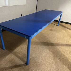 Blue 10-Foot Conference Table for Meetings and Collaboration.