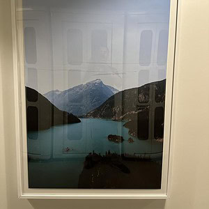 Mountain and lake landscape artwork with scenic mountain views and water reflections.